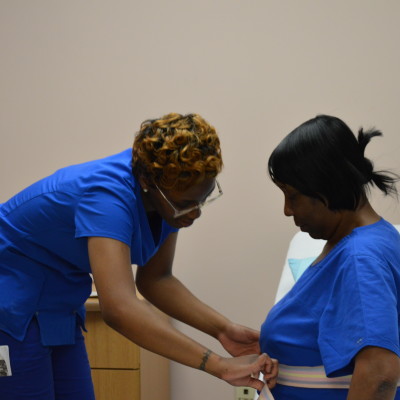 nursing-assistant-checking-patient